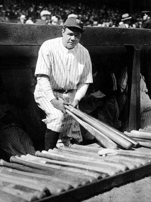 Babe Ruth Holding Bats