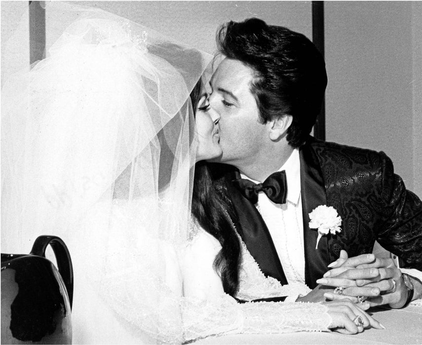 Elvis and Priscilla Kissing at Their Wedding